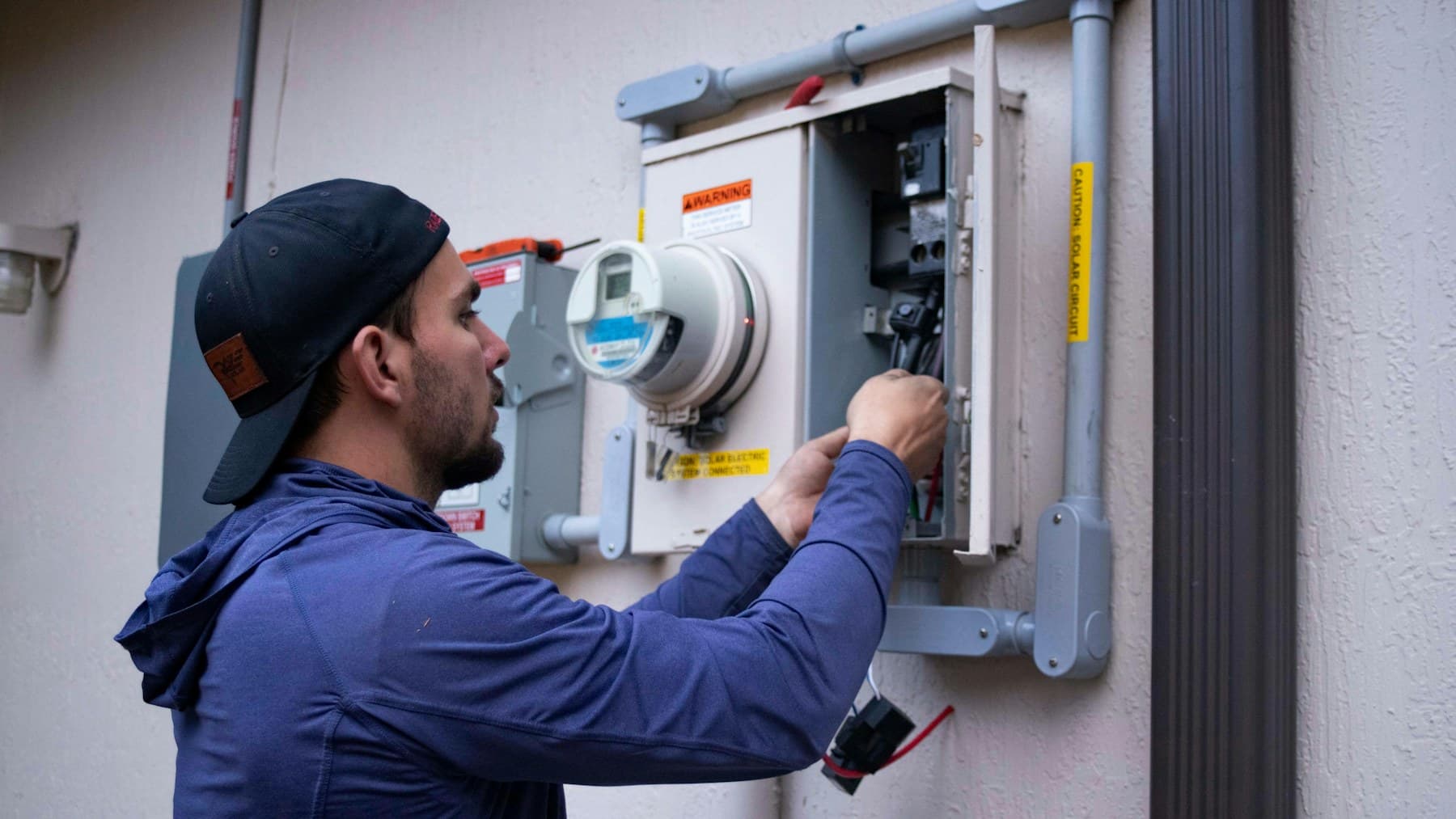 A technician working on metering infrastructure
